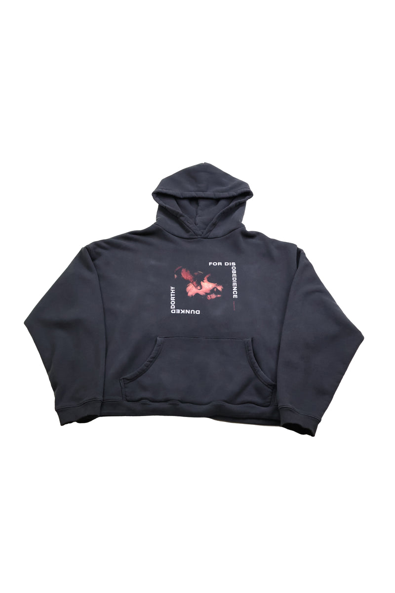 Black hoodie with a graphic design on the chest against a white background